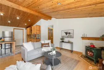 French doors lead you into a great room with vautled wood ceilings!
