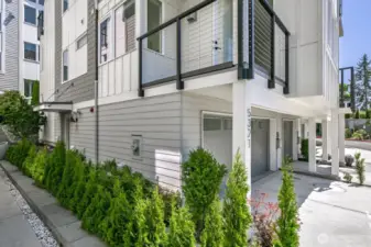 The front entry is to the left. Note the view deck off the main living area.
