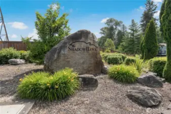 Entry with landscaping.