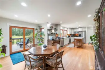 The kitchen seamlessly flows into the dining room and out to the back deck - an ideal layout for entertaining!