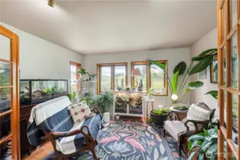 French doors open to the office currently used as a cozy reptile haven, but perfect for whatever you need!