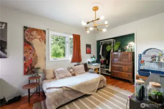 Spacious 3rd bedroom upstairs with updated modern light fixtures throughout the home.