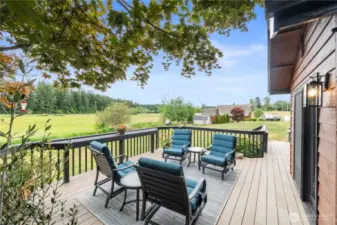 The expansive deck is the perfect spot to savor your morning coffee while watching the sunrise.