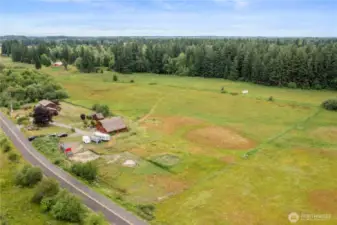 Follow the trail through 10 acres of hay-producing pasture, cross over Yelm Creek, and arrive at your own secluded forest - complete with merchantable timber.