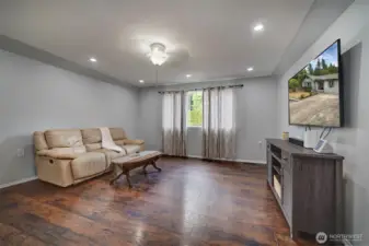 Open living room with recessed lighting.