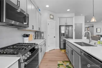 Galley view of kitchen to walk in pantry