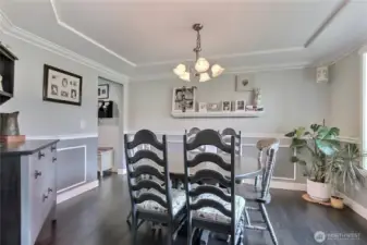 The dining room is designed with elegance in mind, featuring a beautifully crafted coved ceiling and sophisticated wains coating that enhances the overall ambiance and creates a truly refined space.