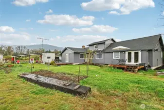 From back of house with mountains