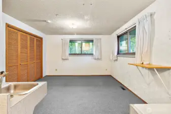 looking out into primary bedroom from bathroom area