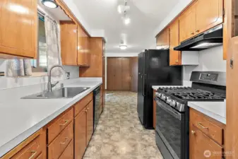 gallery kitchen splits the 2 wings of the house