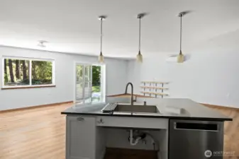 Extra large, deep sink and a breakfast bar on this very large and functional kitchen island.