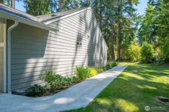 Beautifully landscaped yard and paved walkways.
