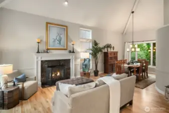 Entering the home, you will be greeted by the soaring vaulted ceilings and gleaming hardwood floors.