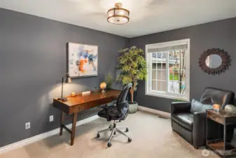 French doors lead to mainfloor home office located just off the entryway.
