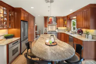 Gather around the beautiful 9 1/2 ft island. Also note the 2nd electric oven.