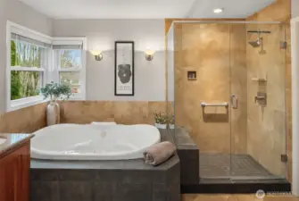 Shower with frameless shower surround and built-in seat/nook for storage.