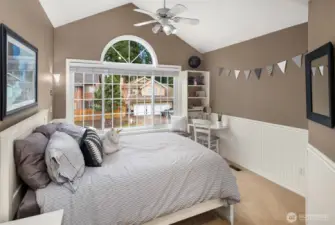 Upstairs bedroom with built-in window seat, desk, and beadboard accents. This room has a large closet not shown