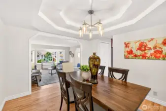 A second view of the dining room highlights the easy flow between the main living spaces and the kitchen beyond. Buyers will appreciate having a true formal dining area that adds flexibility for both casual and special occasion use.