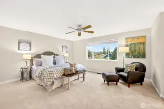 The spacious primary suite offers room to spread out and create a true retreat at the end of the day. New carpet adds comfort underfoot, while the large window brings in natural light and a pleasant outlook.