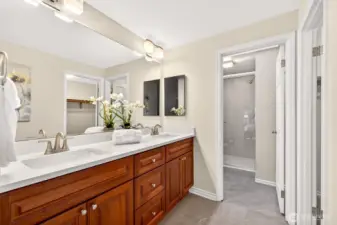 The primary bath includes a dual sink vanity, good storage, and a layout designed to support everyday routines with ease. Its direct connection to the primary suite adds privacy and convenience.