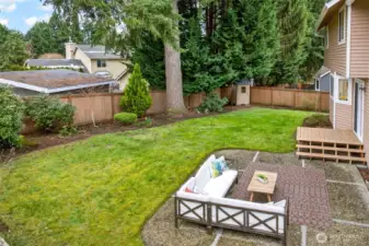 The backyard offers a broad lawn, established plantings, and a fully fenced layout that supports a wide range of outdoor uses. Buyers will appreciate the balance of open space, privacy, and manageable upkeep.
