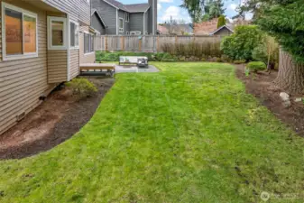 The generous lawn offers flexibility for recreation, gardening, pets, or simply enjoying more outdoor space at home. Buyers looking for a yard that is both usable and private will find real value here.