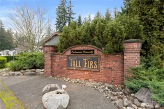 When you drive into your new neighborhood, you'll be greeted by the Tall Firs community entrance sign.