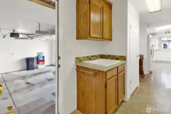 Entrance from garage into laundry/mudroom. Large utility sink.