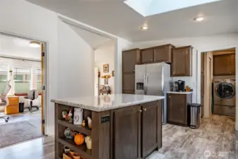 Kitchen, Office to the left, entry in the center background laundry and access to the garage via covered patio.