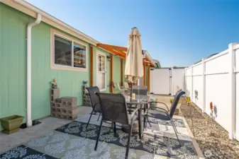 Low maintenance back yard with covered patio and covered deck. Fully fenced all the way around the other side of the home.