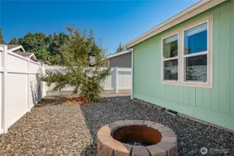 Low maintenance back yard with covered patio and covered deck. Fully fenced all the way around the other side of the home. Fire pit and a Honey Crisp apple tree