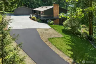 Freshly paved road leading up to the house