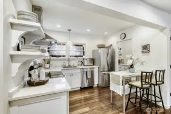 Modern upgrades finished with charming light fixtures and stained glass window