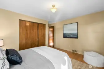 1 of 2 bedrooms on the main floor showing the closet.