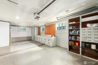 Spacious garage has additional storage options.