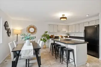 Large, open kitchen with island and generous dining area