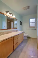 The primary bath features a dual vanity.