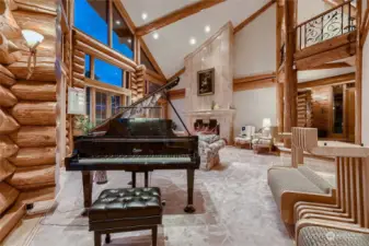 Living Room with 4 sets of double doors to the patio and facing the mountain.