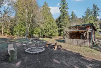 Firepit and outbuilding.