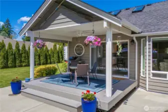 Covered patio with gas-plumbed BBQ and firepit, perfect for entertaining
