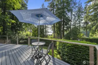 Wraparound outdoor space offering peekaboo water views and relaxation zones