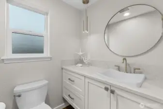 powder room on main level with stylish fixtures