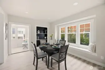Gather in the spacious dining room, where custom built-in shelving and a charming window bench create the perfect blend of style and function. Thoughtful craftsmanship and natural light make this space ideal for everyday meals or hosting dinner parties.