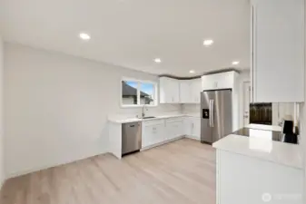 This stunning kitchen has room for a large dining room table