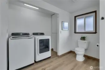 Laundry room with 3/4 bathroom