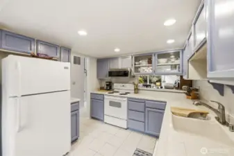 Spacious and bright kitchen. Lots of storage and counterspace with pass through to dining room.