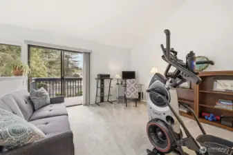 Upstairs spacious loft style bedroom 2 with deck overlooking private backyard and vaulted ceilings.