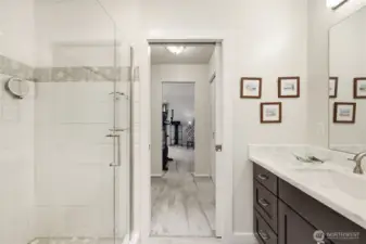 Beautifully updated luxurious bathroom. Quartz countertops, new fixtures, lighting and tile. Huge walk in shower.