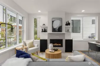 A closer look at the living room reveals a modern fireplace as the centerpiece, surrounded by plush seating.