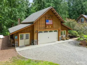 Barn or garage building. Traditional architectural design, English cottage stone & timber.